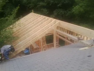 Framing a new roof addition that ties into an existing shingle roof in Mc Clelland